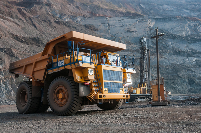 640-open-cast-mine-dump-trucks-drive-alone-industrial-area-of-iron-ore-quarry